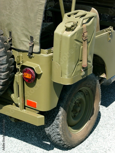 Benzinkanister in Olivgrün eines Geländewagen der amerikanischen Armee im Sonnenscheinbeim Oldtimertreffen am Oldtimer-Park Lippe in Lage bei Detmold in Ostwestfalen-Lippe photo