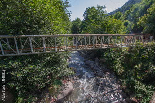 Truss Structure For Supporting Water Transportation Pipes Over A Water Stream In A Forest