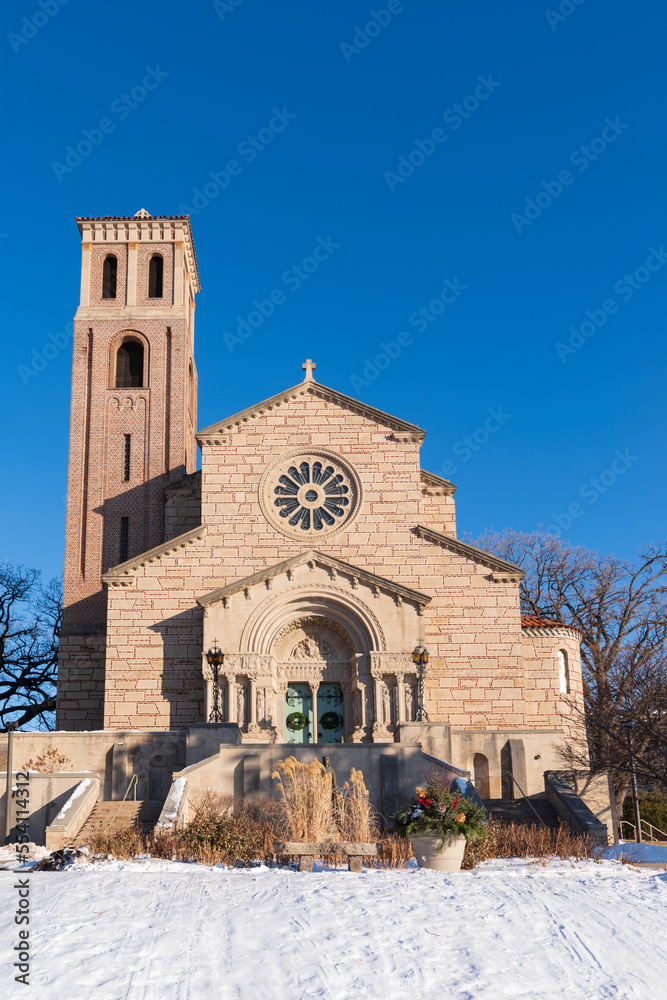 historic university chapel front and tower of romanesque architecture in saint paul minnesota
