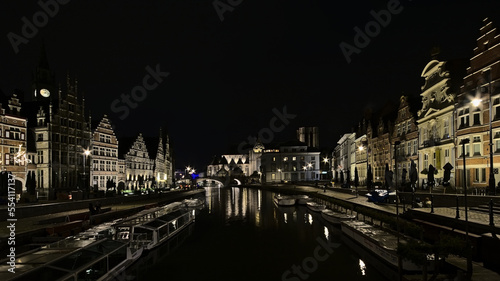 illuminated Saint Michael s bridge and roman catholic Church and medieval guilld houses along river Lys in Ghent Flanders Belgium 