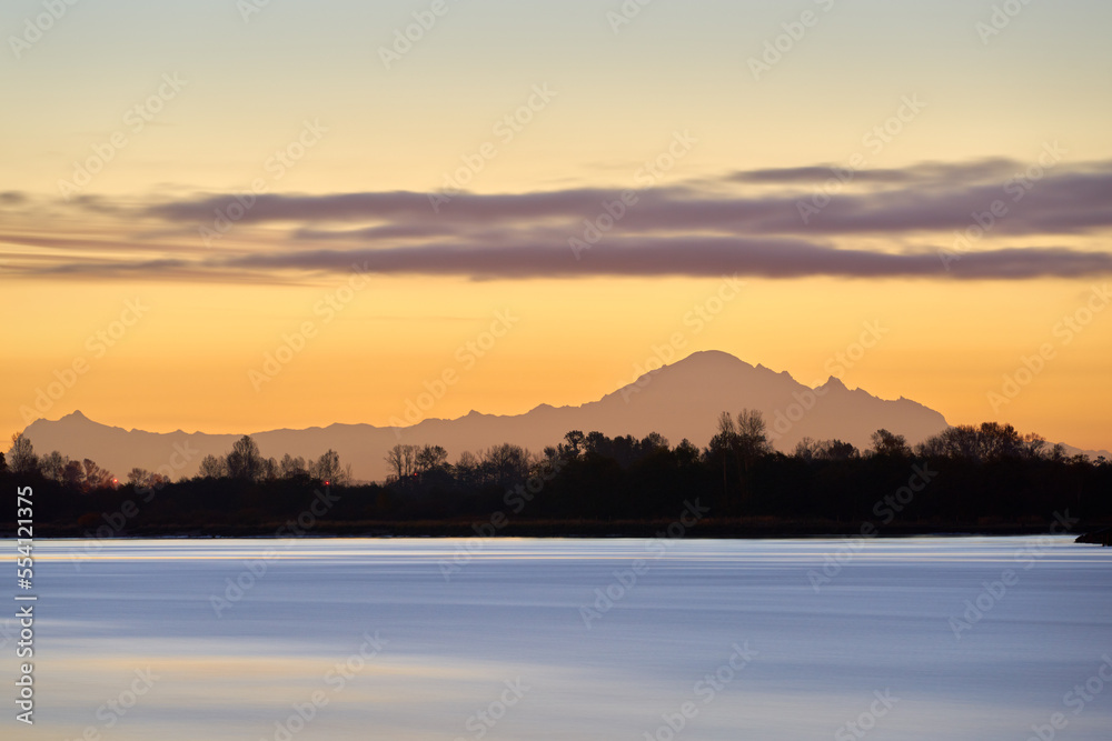 Tranquil Fraser River Dawn. Quiet early morning dawn on the Fraser River, British Columbia. Mt. Baker on the horizon.
Tranquil Fraser River Dawn. Quiet early morning dawn on the Fraser River, British Columbia. Mt. Baker on the horizon.
