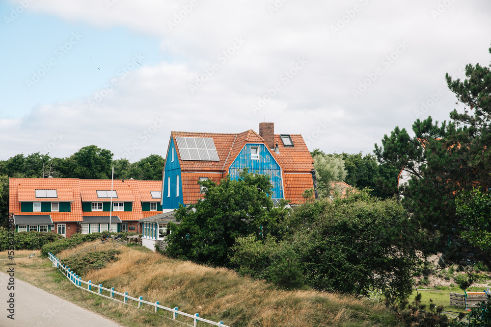 Holiday homes on an island in Germany. houses in Germany. Clinker houses between the dunes Holiday homes on an island in Germany. houses in Germany. Clinker houses between the dunes