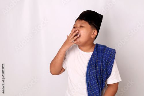 Happy asian boy in ramadan clothes concept standing and laughing. Isolated on white background
