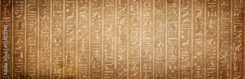 Old Egyptian hieroglyphs on an ancient background. Wide historical and culture background. Ancient Egyptian hieroglyphs as a symbol of the history of the Earth. photo