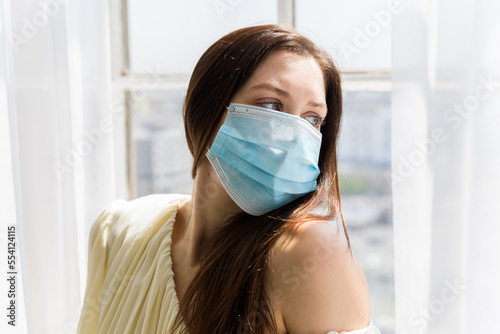 Girl in mask looking over shoulder