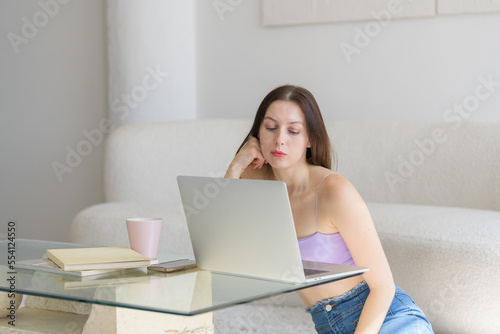 Girl thinking while at computer