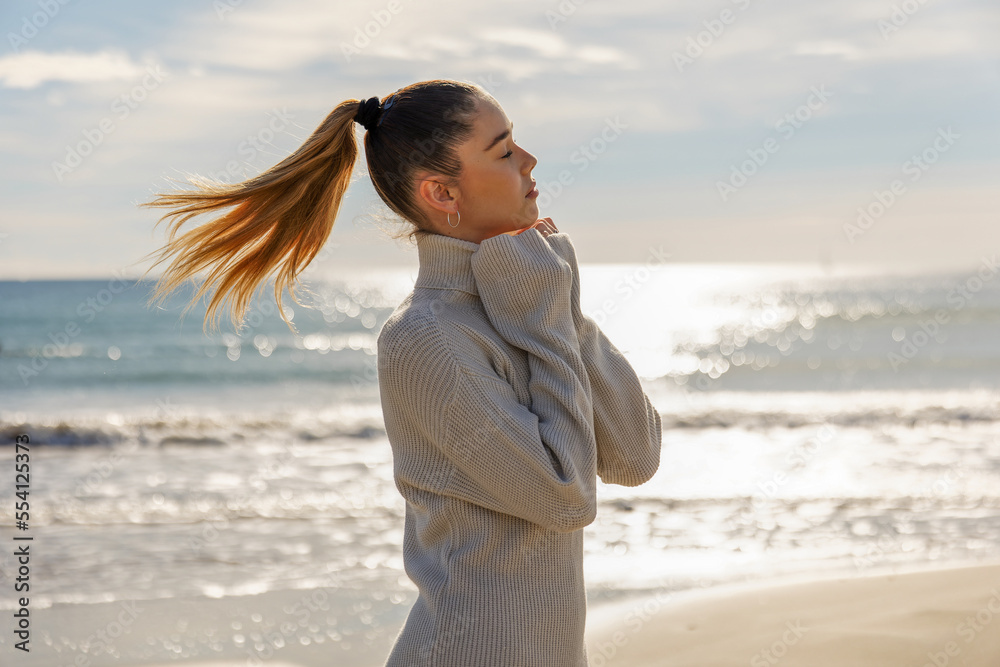 Portrait of a young pretty girl on the background of the sea Portrait of a young pretty girl on the background of the sea