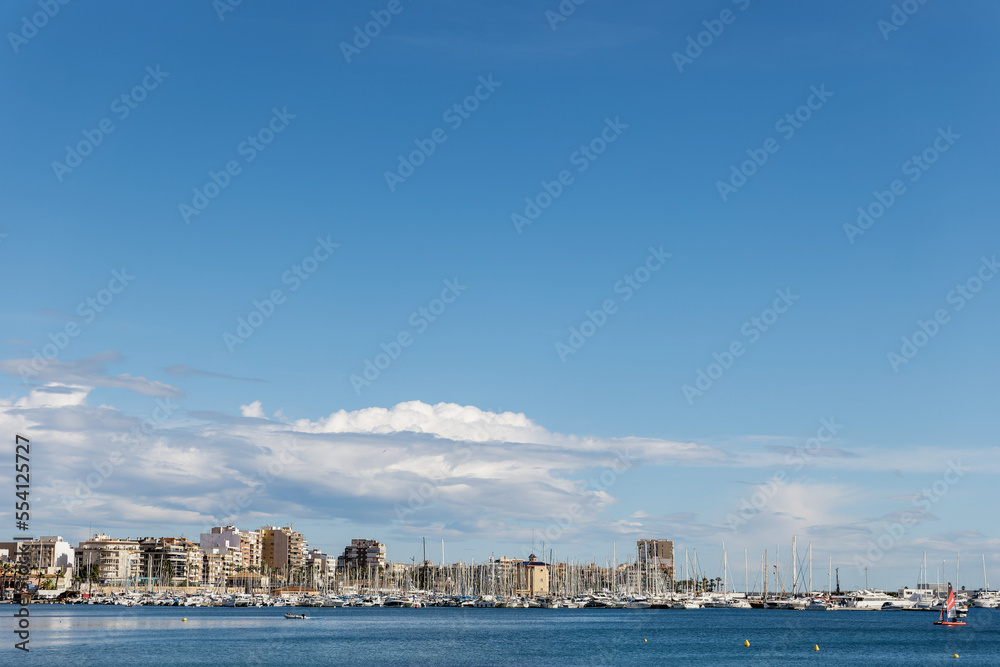 Picturesque view of the city and yachts on the sea