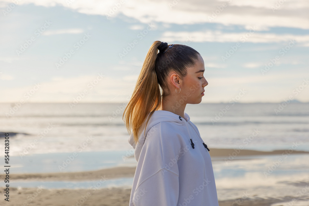 Portrait of a young pretty girl on the background of the sea Portrait of a young pretty girl on the background of the sea