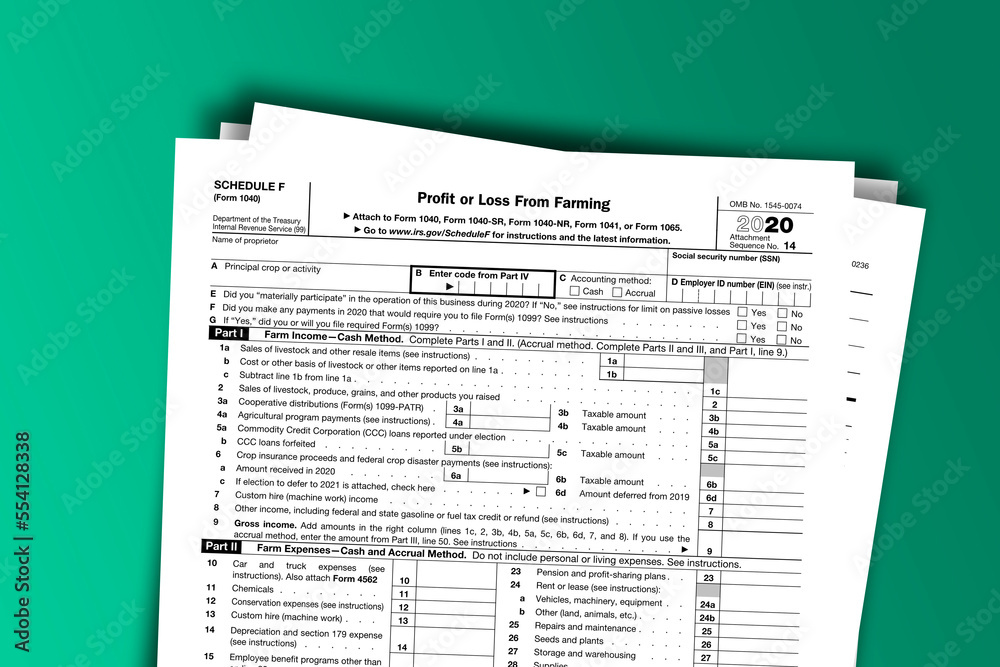 Fototapeta premium Form 1040 (Schedule F) documentation published IRS USA 12.16.2020. American tax document on colored