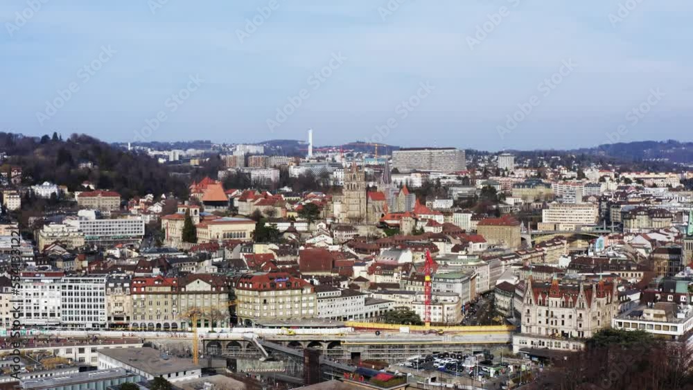 Intro shot of Cathedral in Lausanne Switzerland city with construction tower cranes Intro shot of Cathedral in Lausanne Switzerland city with construction tower cranes