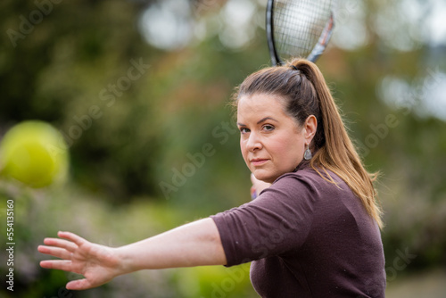 close up of a beautiful girl  hitting tennis balls © William