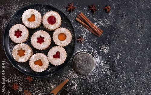 Christmas Linzer cookies on dark background. Top view. Flat lay.