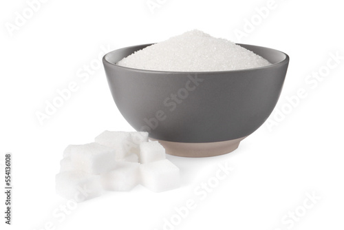 Granulated and cubed sugar with bowl on white background