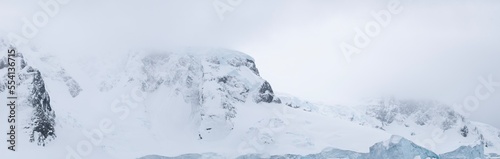 The jagged rock, icy layers, and snow create the terrain of Antarctica. 