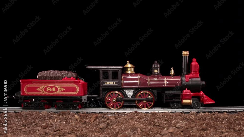 Steam Locomotive Engine model toy train travels down tracks with transparent alpha channel composite loop-able 
