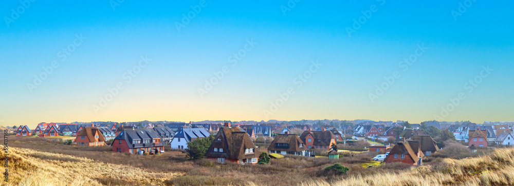 typical reed roofed house in Wenningstedt at the Island of Sylt