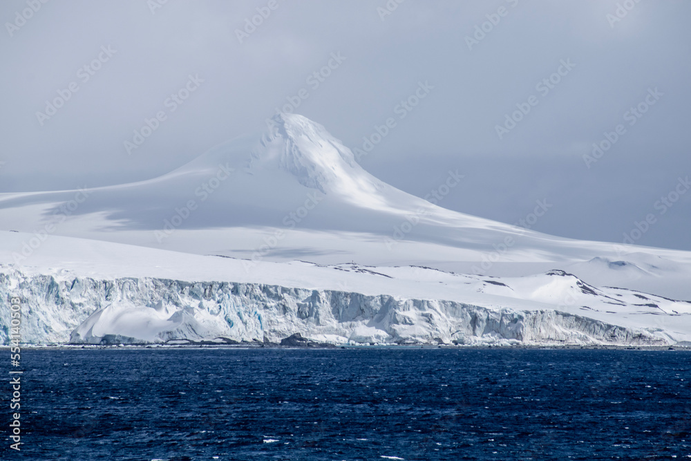 The jagged rock, icy layers, and snow create the terrain of Antarctica. The jagged rock, icy layers, and snow create the terrain of Antarctica.