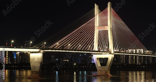 part of colorful Second Wuhan Yangtze River Bridge and traffic at night. A cable-stayed bridge across the Yangtze River in Wuhan, Hubei province, China photo