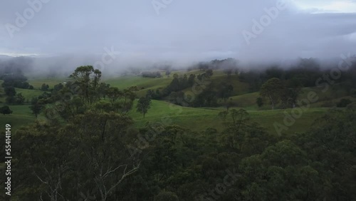 Nambucca green Valley with low clouds, New South Wales in Australia. Aerial forward photo