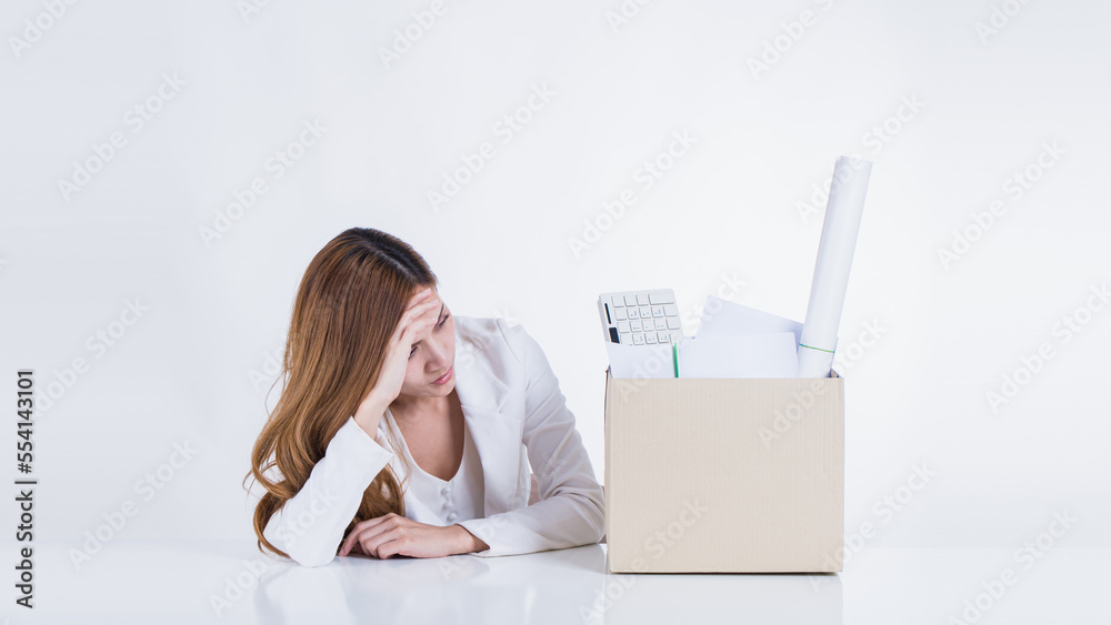 Business people holding cardboard box with her things and carrying personal belongings Getting fired and changing jobs, changing job positions. The concept of unemployment or resignation. Business people holding cardboard box with her things and carrying personal belongings Getting fired and changing jobs, changing job positions. The concept of unemployment or resignation.