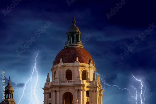 Photography the bell tower on the city hall buildings covered in red brick with storm clouds