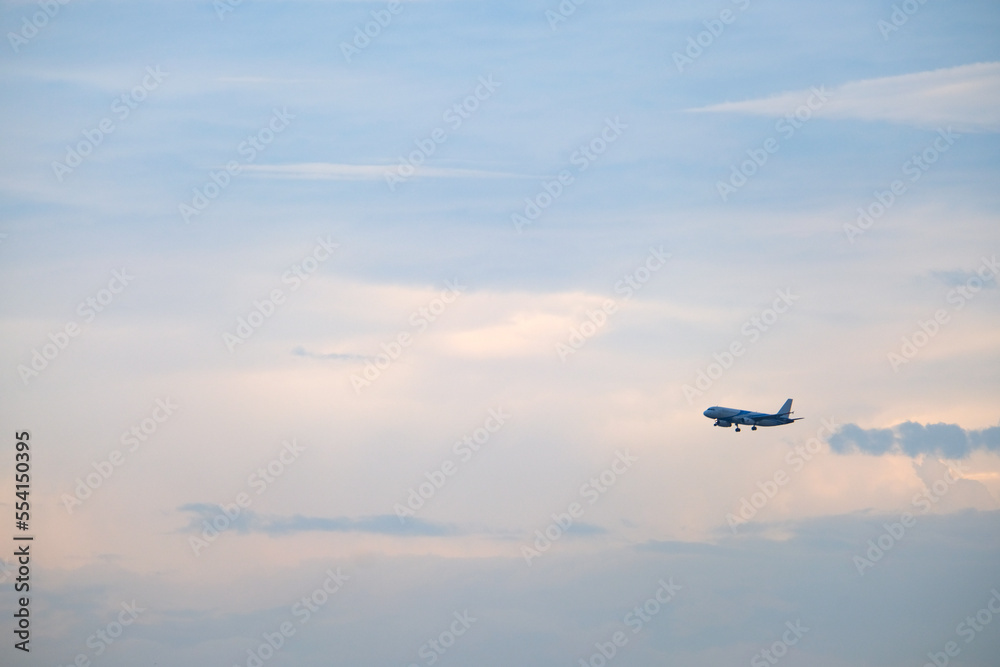 Airplanes, passengers flying in the sky, preparing to land at the airport