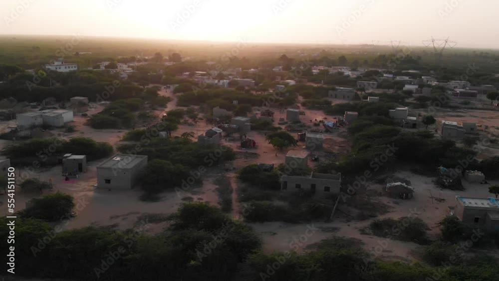 Aerial drone shot of small village in Sindh Pakistan. Top angle shot of small houses situated in the Sindh Pakistan.
Aerial drone shot of small village in Sindh Pakistan. Top angle shot of small houses situated in the Sindh Pakistan.