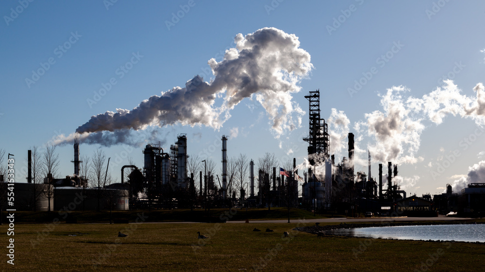 Illinois, USA - March 27, 2022: An oil refinery facility skyline. An oil refinery is a facility that takes crude oil and distills it into various useful petroleum products.  