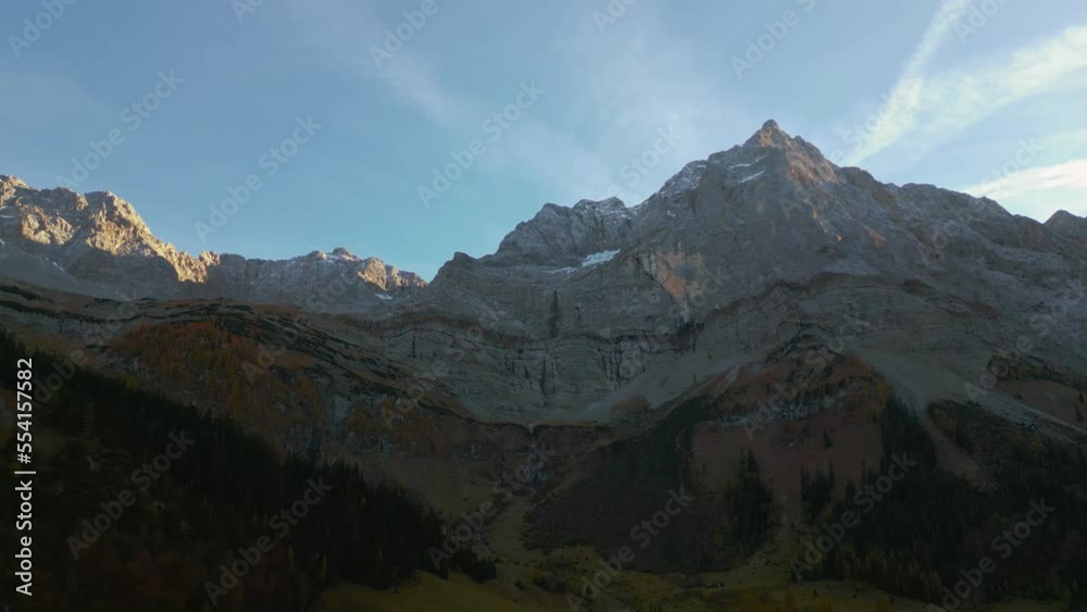 Parallax alps mountain peaks in Austria Tyrol with romantic and scenic green grass meadows and maple trees in natural landscape. Cinematic aerial drone panoramic hiking outdoors at Ahornboden in 4K. Parallax alps mountain peaks in Austria Tyrol with romantic and scenic green grass meadows and maple trees in natural landscape. Cinematic aerial drone panoramic hiking outdoors at Ahornboden in 4K.