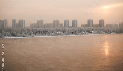 Winter sunset panoramic view of the Yenisei River and the city of Krasnoyarsk.