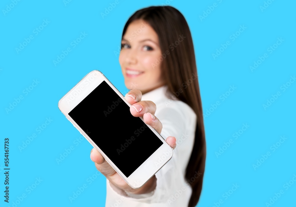 Young woman hold a smartphone and posing Young woman hold a smartphone and posing