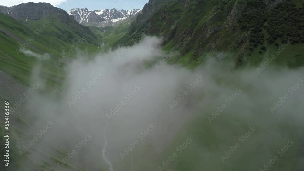 Caucasus, Ossetia. Dzamarash Gorge. Clouds in the valley. Caucasus, Ossetia. Dzamarash Gorge. Clouds in the valley.