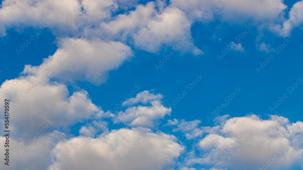 Blue sky with clouds background. Sky daylight. Natural sky composition. Element of design. Blue sky with clouds background. Sky daylight. Natural sky composition. Element of design.