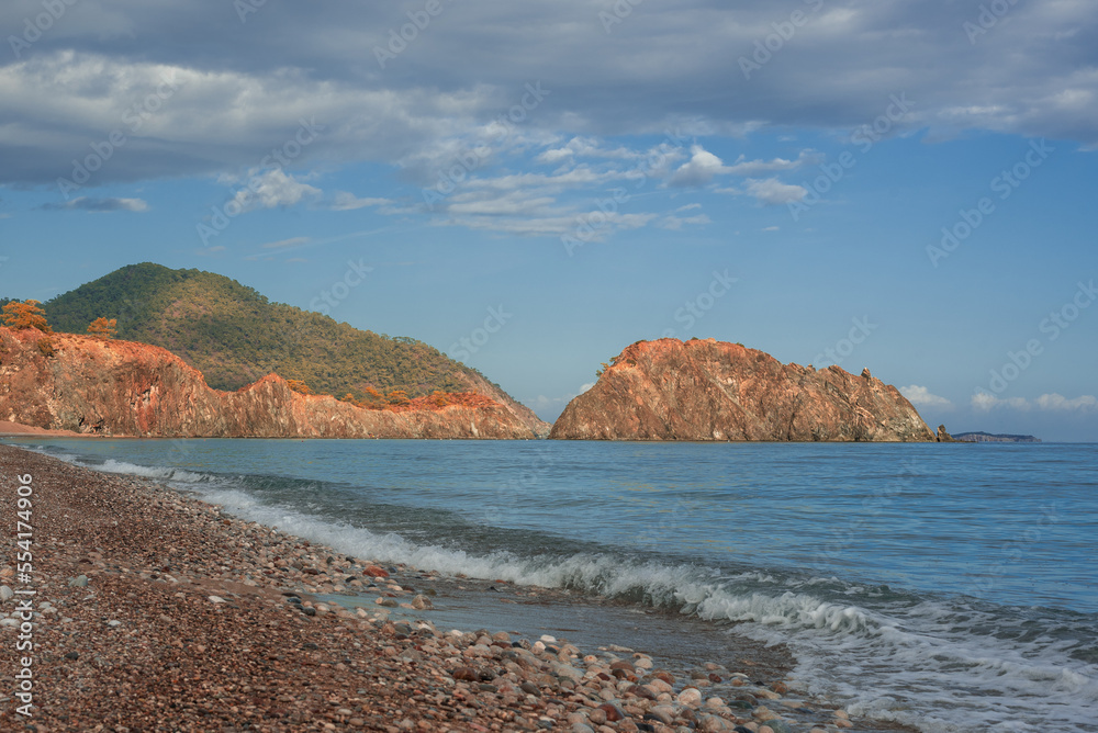 View of Cirali beach with rock outcrops, Kemer, Turkey.