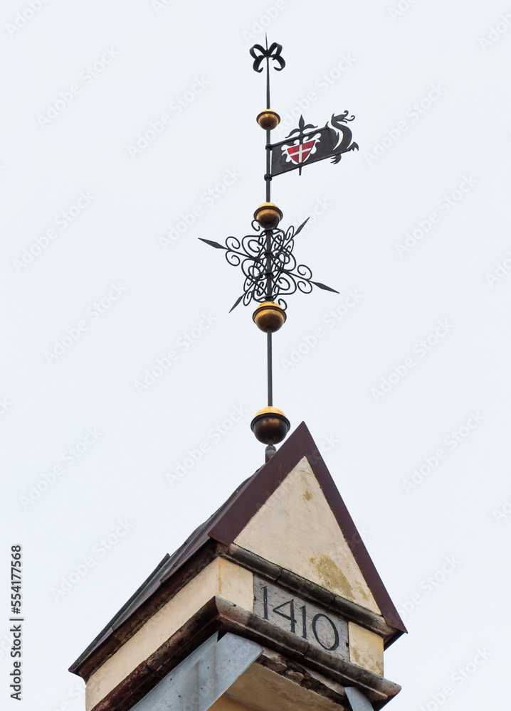 Wind direction indicator on a house roof Tallin . Wind direction indicator on a house roof Tallin .