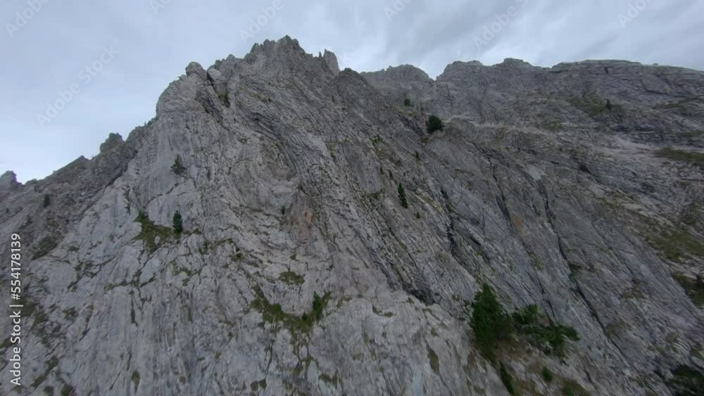 FPV aerial view rising to Esterri D'aneu rocky alpine woodland mountain peaks, Catalonia, Spain FPV aerial view rising to Esterri D'aneu rocky alpine woodland mountain peaks, Catalonia, Spain