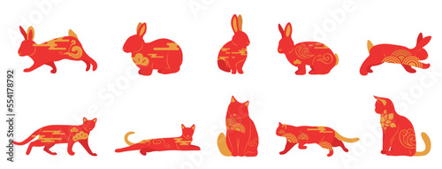 Set of red Chinese New Year rabbits and cats on white background