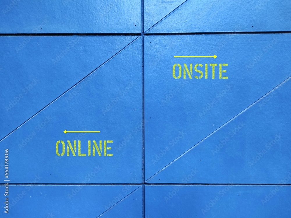 Blue wall with text and direction to ONLINE and ONSITE, concept of education and work in pandemic lockdown, digital revolution turns conventional working - or hybrid combination - obrazy, fototapety, plakaty 