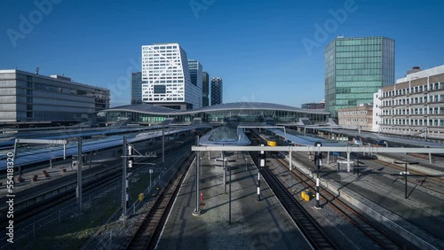 Time Lapse of local trains arrive and depart the modern station at Utrecht in the Netherlands photo