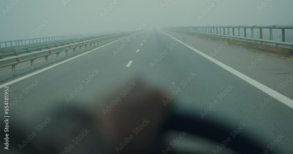 Driving in the fog scene with hand on the wheel slow motion 4K