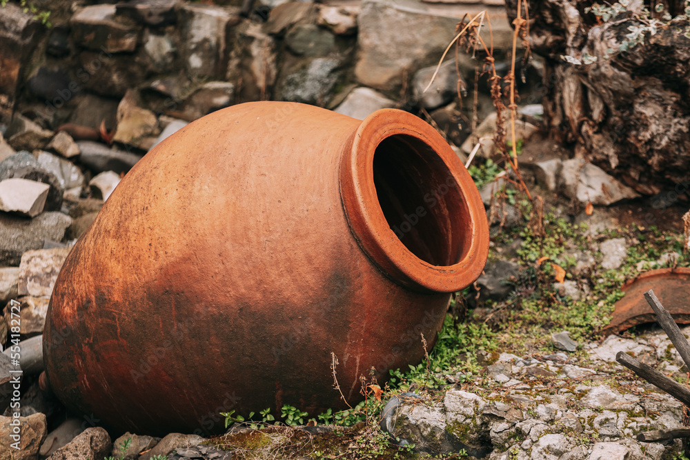 old Abandoned Kvevri on Ground. The Large Earthenware Vessel Used For The Fermentation, Storage And Ageing Of Traditional Georgian Wine.