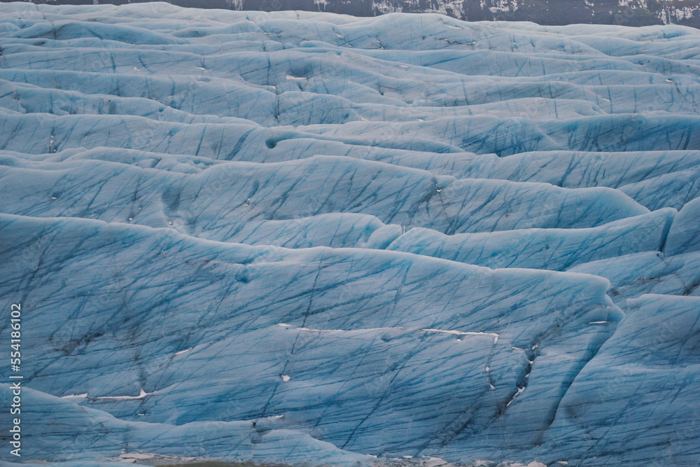 Fototapeta premium Turquoise glacier covering ground landscape photo. Beautiful nature scenery photography with polar site on background. Idyllic scene. High quality picture for wallpaper, travel blog, magazine, article