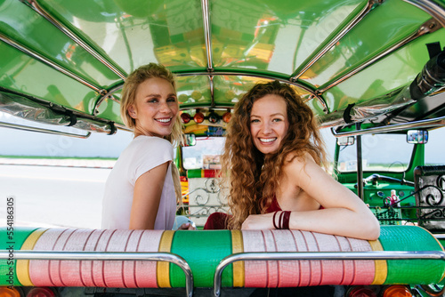 Photography Couple of beautiful girls visiting bangkok maining attractions