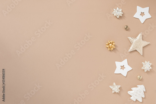 Christmas composition. Gifts, craft and golden decorations on white background. Flat lay, top view, copy space