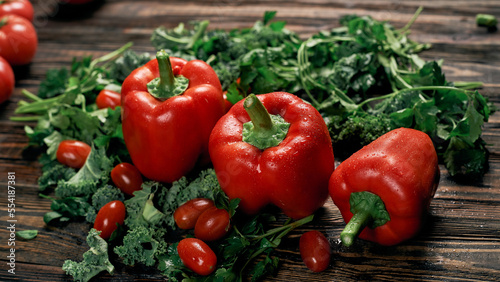 red bell pepper on a wooden kitchen board.