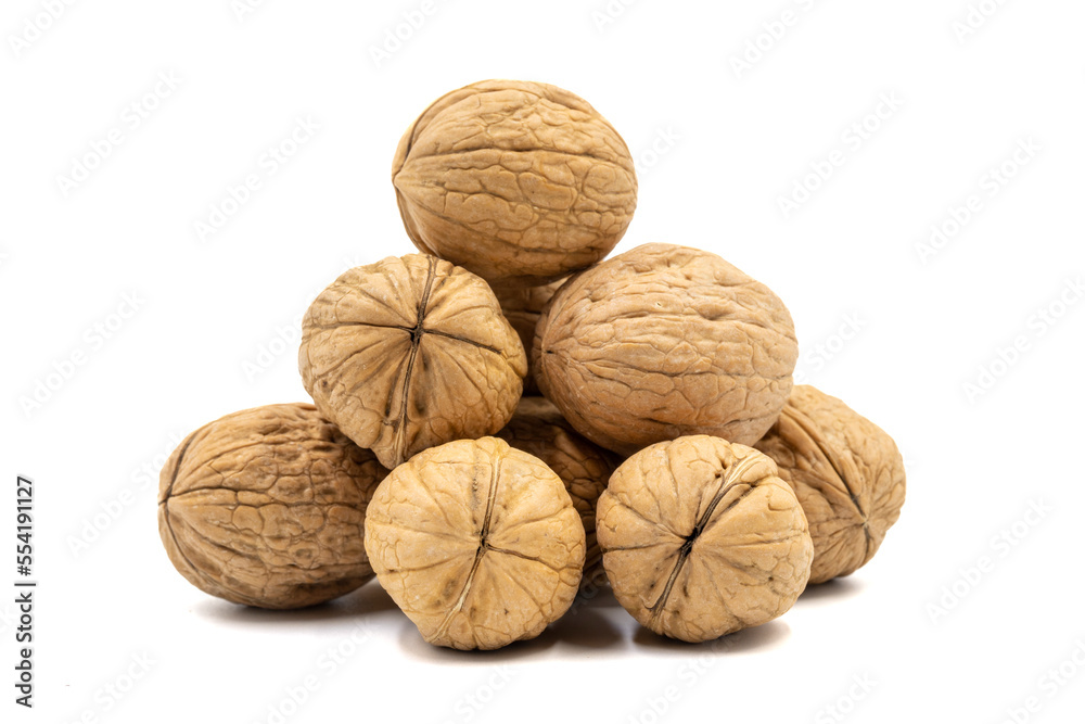 Heap of shelled walnuts isolated on a white background. Clipping Path. Full depth of field. close up Heap of shelled walnuts isolated on a white background. Clipping Path. Full depth of field. close up