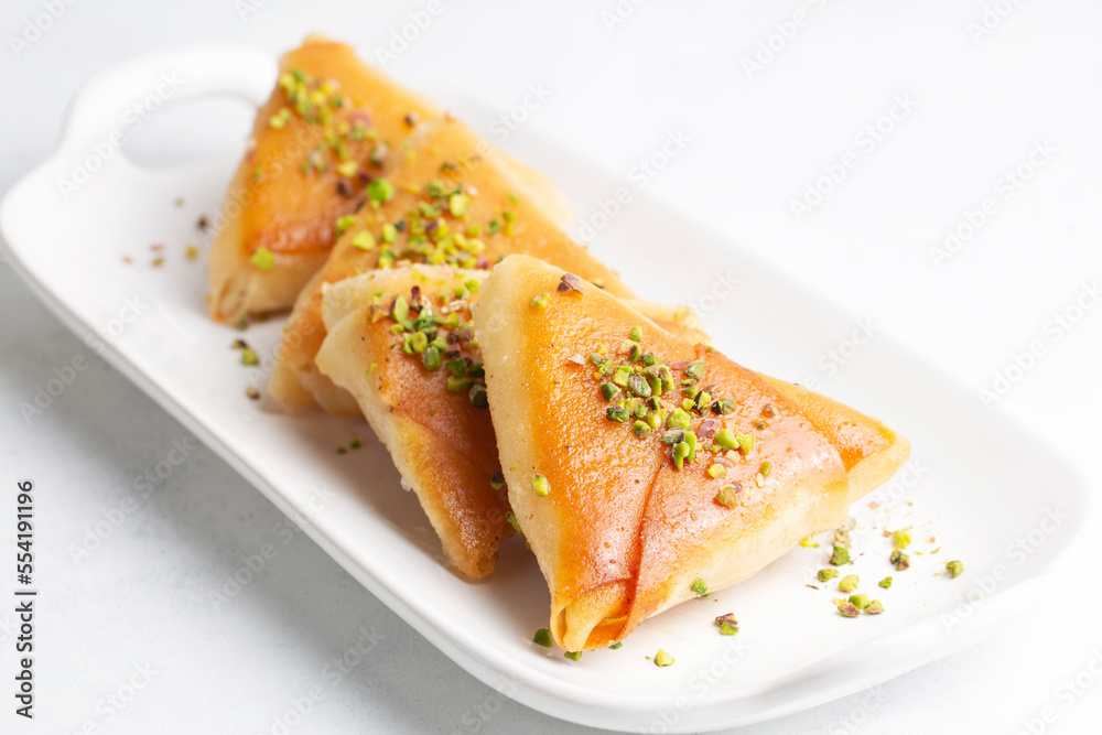 Traditional Turkish desserts; custard triangular dessert, albanian dessert ( Turkish name; Arnavut tatlisi or muhallebili muska tatlisi)