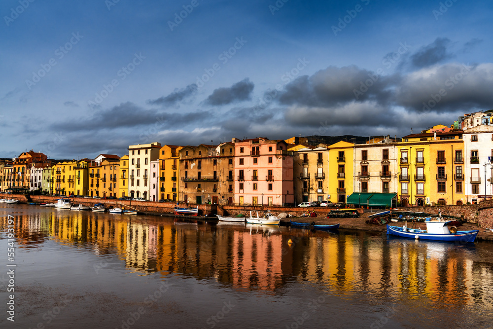 colorful houses and fishing boats on the waterfront of Bosa on the River Terno