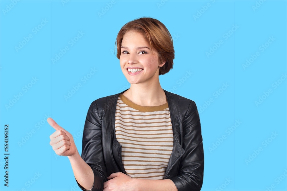 Optimistic young woman posing on background Optimistic young woman posing on background